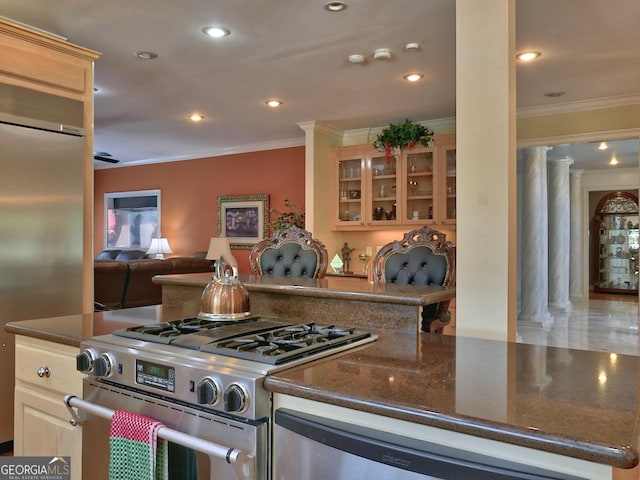 205 Somerset Ct, Mcdonough, GA 30253 - kitchen with appliances with stainless steel finishes, ornamental molding, ornate columns, glass insert cabinets, and recessed lighting