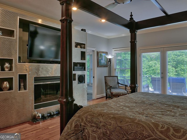 205 Somerset Ct, Mcdonough, GA 30253 - bedroom with wood finished floors, crown molding, and access to exterior