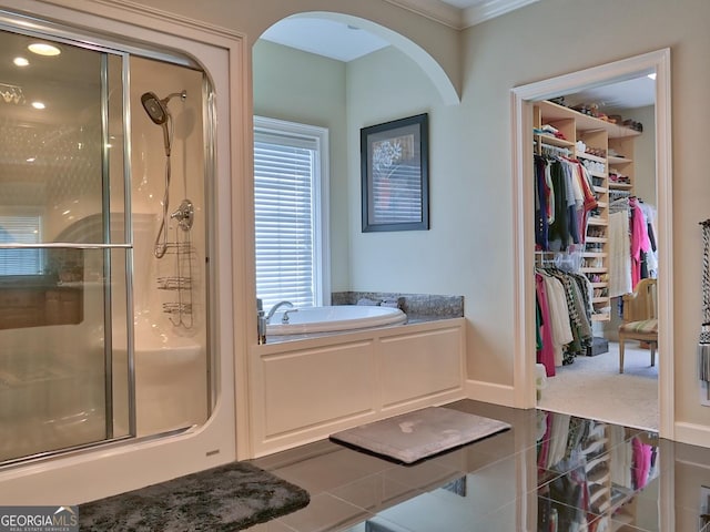 205 Somerset Ct, Mcdonough, GA 30253 - full bath featuring a stall shower, a garden tub, a walk in closet, and ornamental molding