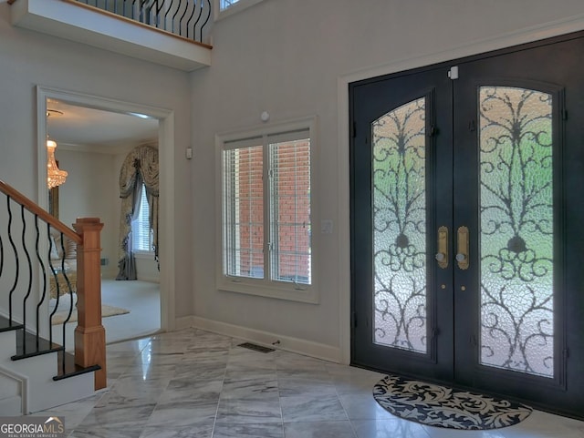 205 Somerset Ct, Mcdonough, GA 30253 - foyer with french doors, plenty of natural light, and stairway