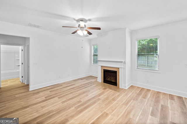 3805 Alden Pl, Cumming, GA 30028 - unfurnished living room featuring ceiling fan, light wood finished floors, a glass covered fireplace, and ornamental molding