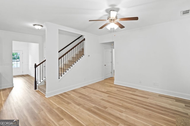 3805 Alden Pl, Cumming, GA 30028 - empty room featuring light wood finished floors, stairs, ceiling fan, and ornamental molding