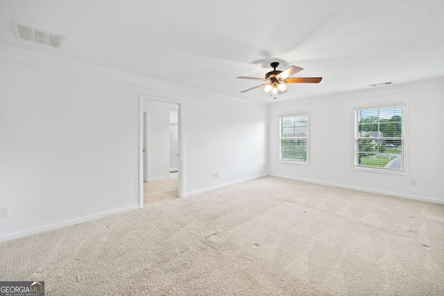 3805 Alden Pl, Cumming, GA 30028 - spare room featuring ornamental molding, ceiling fan, and light colored carpet