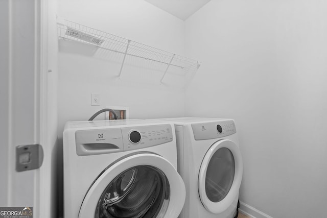 3805 Alden Pl, Cumming, GA 30028 - washroom featuring separate washer and dryer and attic access
