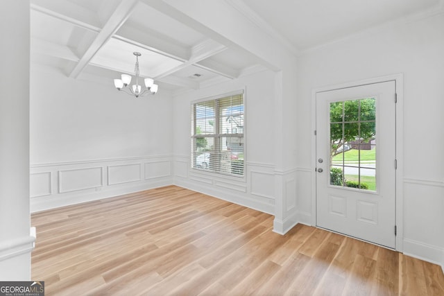 3805 Alden Pl, Cumming, GA 30028 - entryway featuring a chandelier, beam ceiling, light wood-style flooring, coffered ceiling, and wainscoting