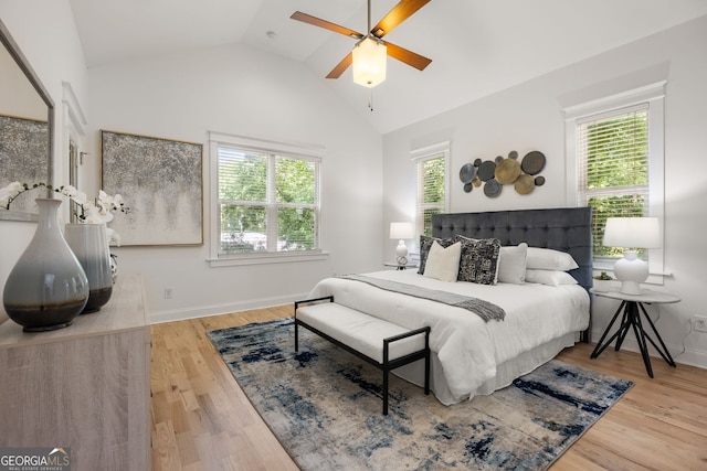 770 Ormewood Ave SE, Atlanta, GA 30312 - bedroom with lofted ceiling, multiple windows, wood finished floors, and baseboards