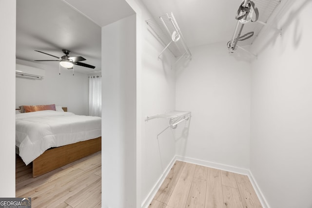770 Ormewood Ave SE, Atlanta, GA 30312 - walk in closet featuring a wall mounted AC, hardwood / wood-style floors, and ceiling fan
