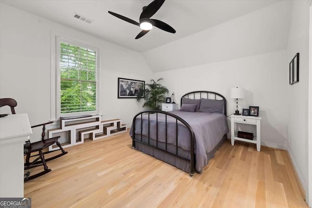 262 Southerland Ter NE, Atlanta, GA 30307 - bedroom featuring light wood-type flooring, vaulted ceiling, and a ceiling fan