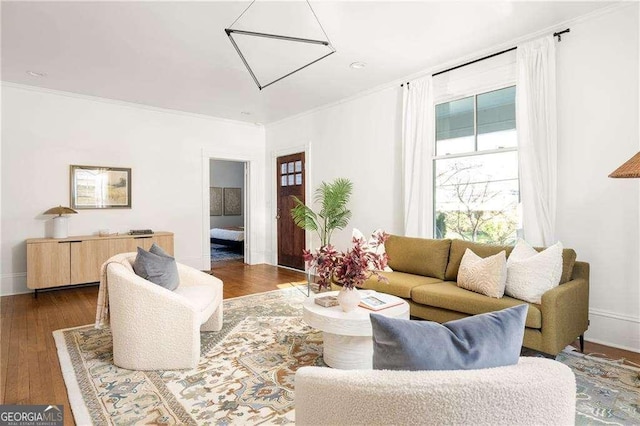629 Hansell St SE, Atlanta, GA 30312 - living room featuring wood finished floors, crown molding, and baseboards