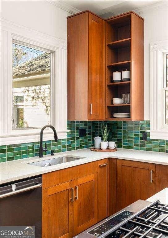629 Hansell St SE, Atlanta, GA 30312 - kitchen with dishwasher, a sink, open shelves, light countertops, and tasteful backsplash