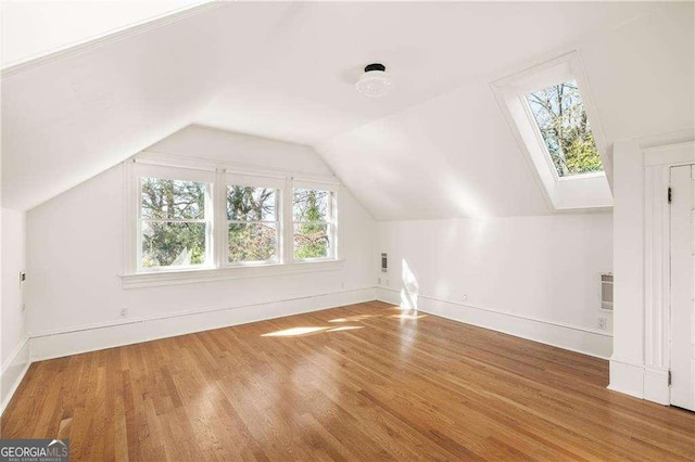629 Hansell St SE, Atlanta, GA 30312 - bonus room featuring wood finished floors, baseboards, and lofted ceiling