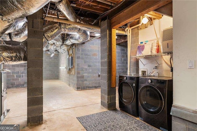 629 Hansell St SE, Atlanta, GA 30312 - unfinished below grade area with washing machine and clothes dryer and concrete block wall