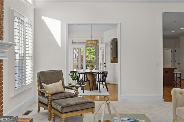 living area featuring wood finished floors and baseboards