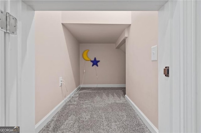 hall with carpet and baseboards