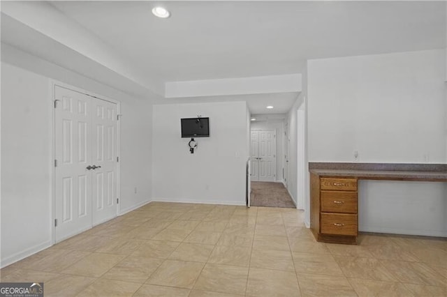 empty room with recessed lighting and baseboards
