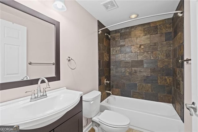bathroom featuring toilet, vanity, and tub / shower combination