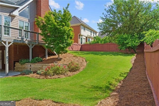 view of yard with a deck