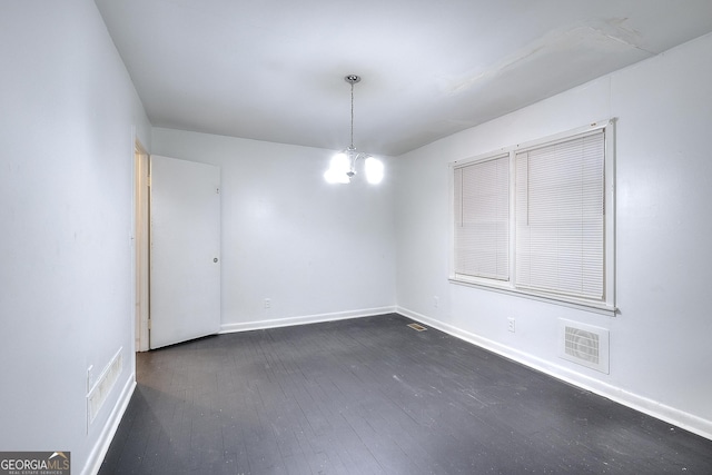 707 E Spring St, Monroe, GA 30655 - spare room featuring dark wood-style flooring and baseboards