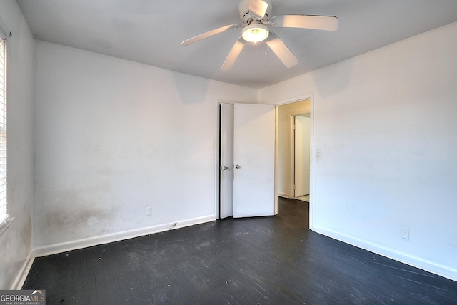 707 E Spring St, Monroe, GA 30655 - spare room with wood finished floors, baseboards, and ceiling fan