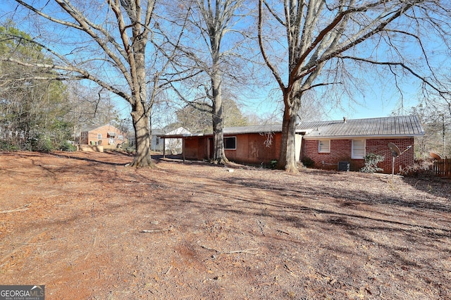 707 E Spring St, Monroe, GA 30655 - view of side of home with metal roof