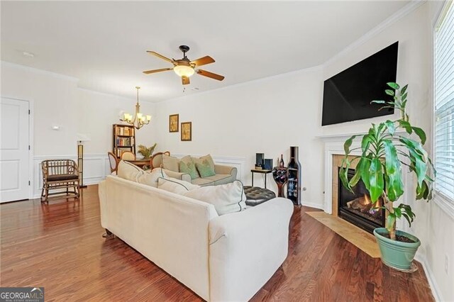 5711 Keys Way, Lithonia, GA 30058 - living room with a fireplace, ceiling fan, healthy amount of natural light, dark wood-type flooring, and ornamental molding