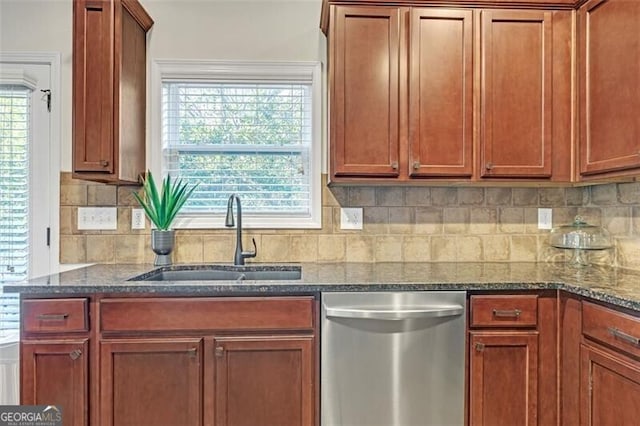 5711 Keys Way, Lithonia, GA 30058 - kitchen featuring stainless steel dishwasher, a sink, tasteful backsplash, dark stone countertops, and brown cabinetry