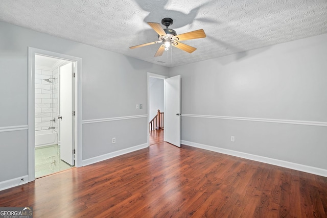 175 River Run, Roswell, GA 30075 - unfurnished bedroom with wood finished floors, baseboards, a textured ceiling, and a ceiling fan