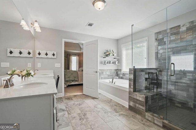 bathroom featuring plenty of natural light, a bath, ensuite bathroom, and a stall shower