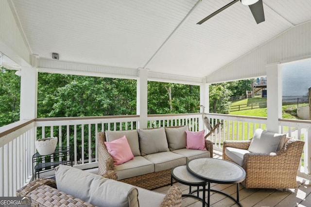 deck with an outdoor hangout area and ceiling fan