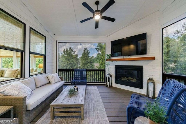 4992 Concert Ln, Marietta, GA 30066 - sunroom with vaulted ceiling, an outdoor living space with a fireplace, and ceiling fan