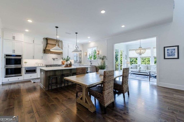 4992 Concert Ln, Marietta, GA 30066 - dining space with dark wood-style flooring, recessed lighting, crown molding, and baseboards