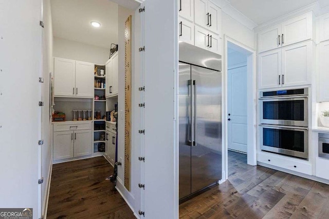 4992 Concert Ln, Marietta, GA 30066 - kitchen featuring appliances with stainless steel finishes, dark wood finished floors, white cabinets, recessed lighting, and open shelves