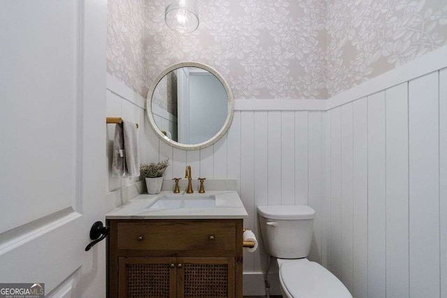 4992 Concert Ln, Marietta, GA 30066 - half bath featuring wallpapered walls, toilet, and vanity