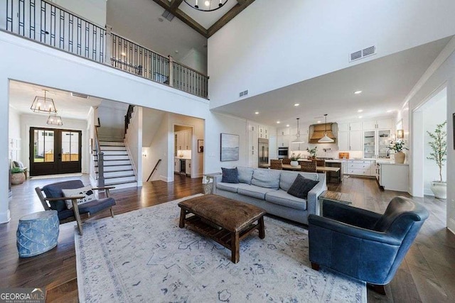 4992 Concert Ln, Marietta, GA 30066 - living room with dark wood-style floors, stairs, and a towering ceiling