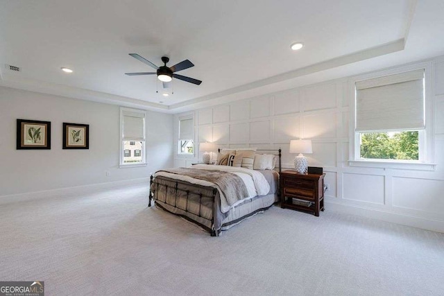 4992 Concert Ln, Marietta, GA 30066 - bedroom with a raised ceiling, light carpet, a decorative wall, recessed lighting, and a ceiling fan