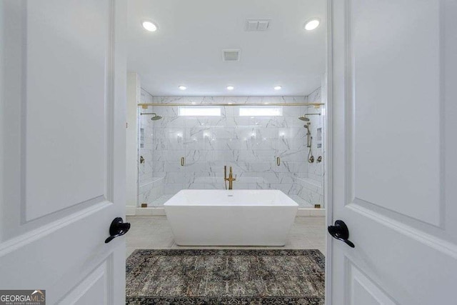 4992 Concert Ln, Marietta, GA 30066 - full bath featuring a marble finish shower, tile patterned floors, a freestanding tub, and recessed lighting