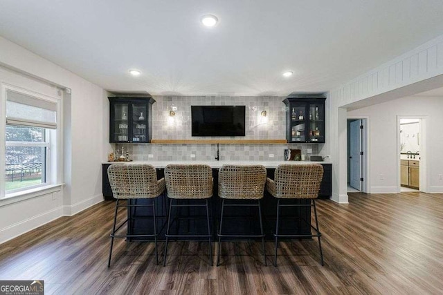 4992 Concert Ln, Marietta, GA 30066 - indoor bar with decorative backsplash, dark wood-style floors, baseboards, and recessed lighting