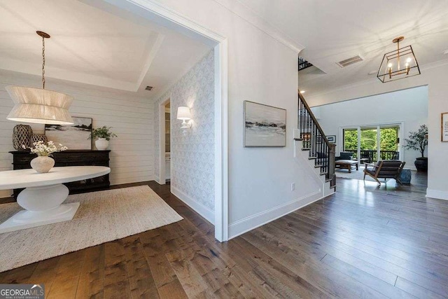 4992 Concert Ln, Marietta, GA 30066 - corridor with baseboards, stairs, dark wood finished floors, ornamental molding, and a chandelier