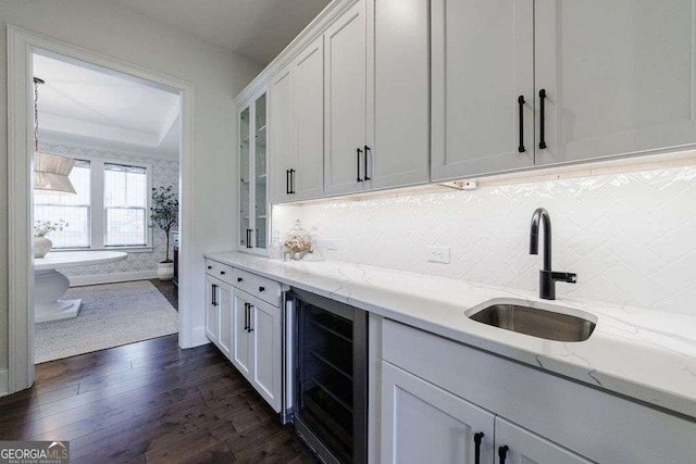4992 Concert Ln, Marietta, GA 30066 - bar area with beverage cooler, a sink, dark wood finished floors, and backsplash