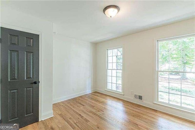 418 Mockingbird Ln, Smyrna, GA 30082 - empty room with light wood-type flooring and baseboards