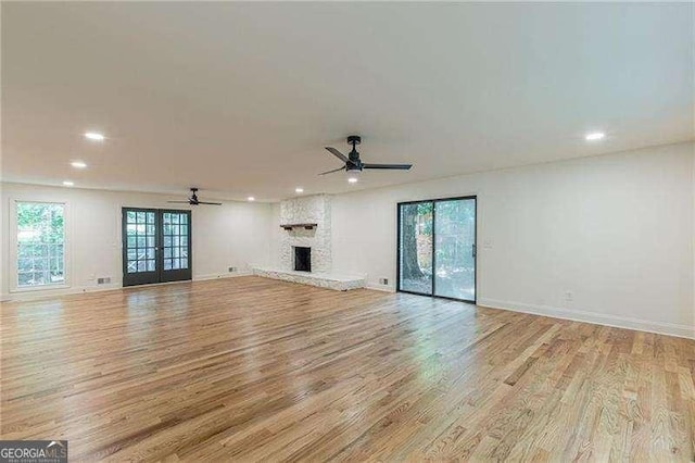 418 Mockingbird Ln, Smyrna, GA 30082 - unfurnished living room featuring ceiling fan, recessed lighting, light wood-style flooring, baseboards, and a fireplace