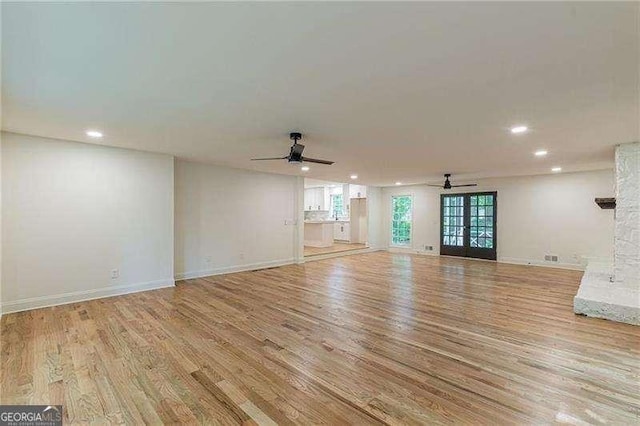 418 Mockingbird Ln, Smyrna, GA 30082 - unfurnished living room with ceiling fan, recessed lighting, light wood-type flooring, and baseboards