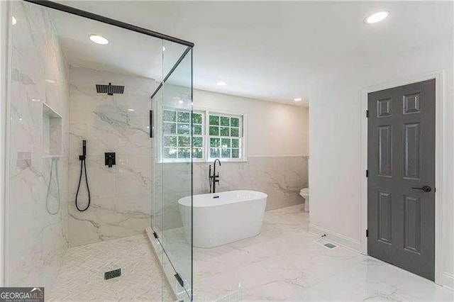 418 Mockingbird Ln, Smyrna, GA 30082 - full bath featuring a freestanding bath, a marble finish shower, marble tiled flooring, and recessed lighting