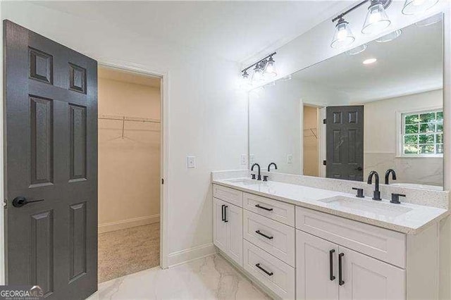 418 Mockingbird Ln, Smyrna, GA 30082 - full bath featuring a spacious closet, double vanity, marble finish floors, and baseboards