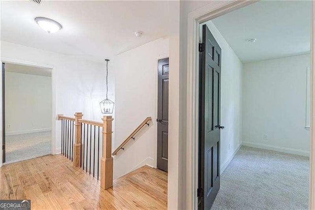 418 Mockingbird Ln, Smyrna, GA 30082 - hall with an upstairs landing, baseboards, and light wood finished floors