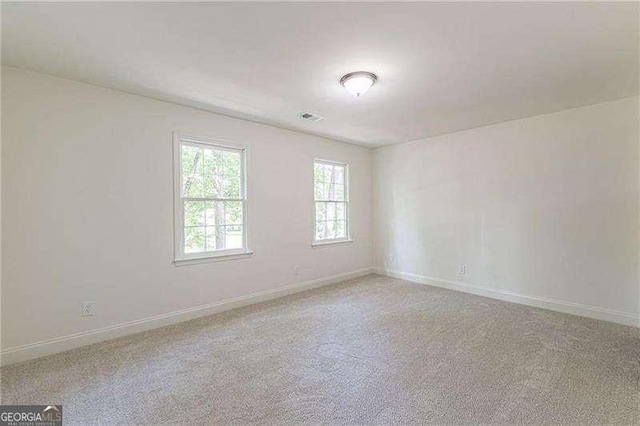 418 Mockingbird Ln, Smyrna, GA 30082 - carpeted spare room featuring baseboards
