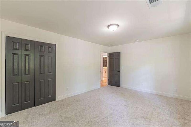 418 Mockingbird Ln, Smyrna, GA 30082 - unfurnished bedroom with baseboards, carpet floors, and a closet