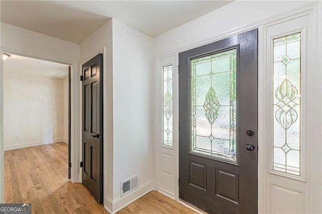 418 Mockingbird Ln, Smyrna, GA 30082 - entryway featuring light wood-style flooring, healthy amount of natural light, and baseboards