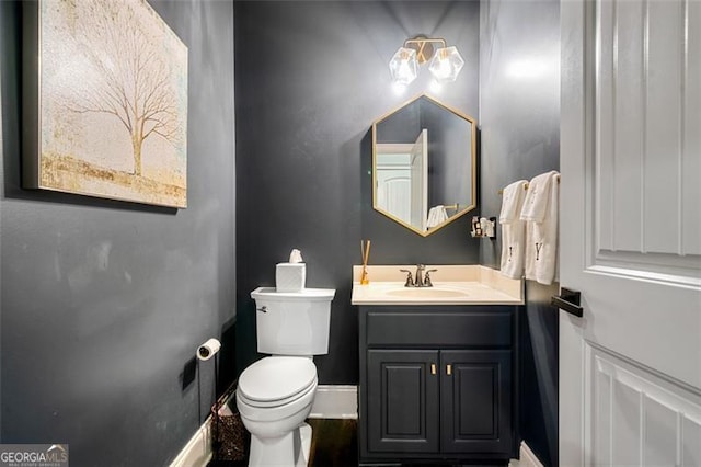 1525 Camden Cove Dr, Cumming, GA 30040 - bathroom with toilet, vanity, and baseboards