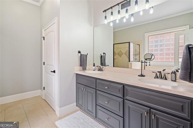 1525 Camden Cove Dr, Cumming, GA 30040 - bathroom with crown molding, a shower stall, double vanity, tile patterned flooring, and baseboards